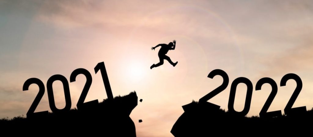 Figure leaping from the cliff of 2021 into a cliff of 2022